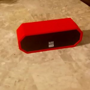 A The Jacket H20 speaker. The brand is Altec Lansing its red, small.